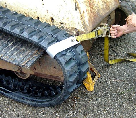 changing tracks on a skid steer|kubota skid steer track replacement.